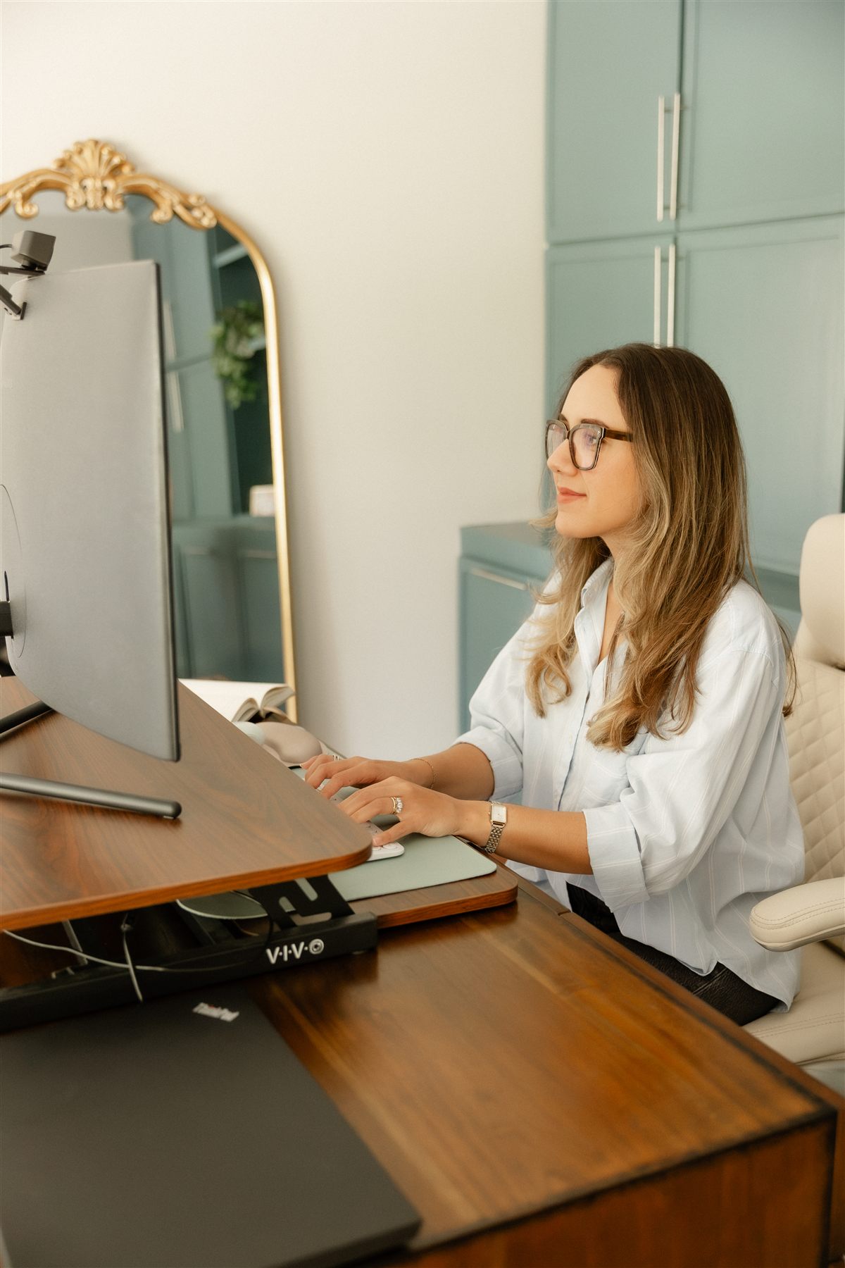 Selena Monette working at her desk